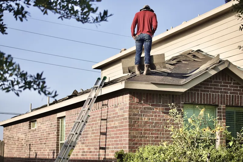 Professional roofer working on a residential roof in Ranchero Village